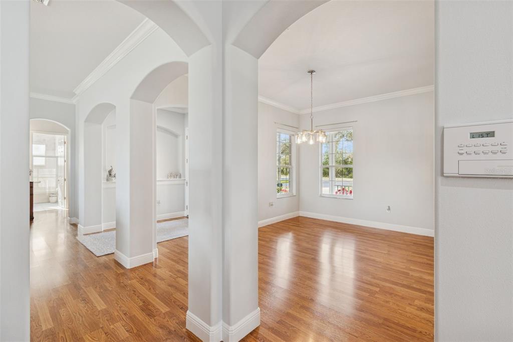 801 Glendora Road Kissimmee, FL 34759 - Photo 16 of 74 a view of an empty room with wooden floor and a window