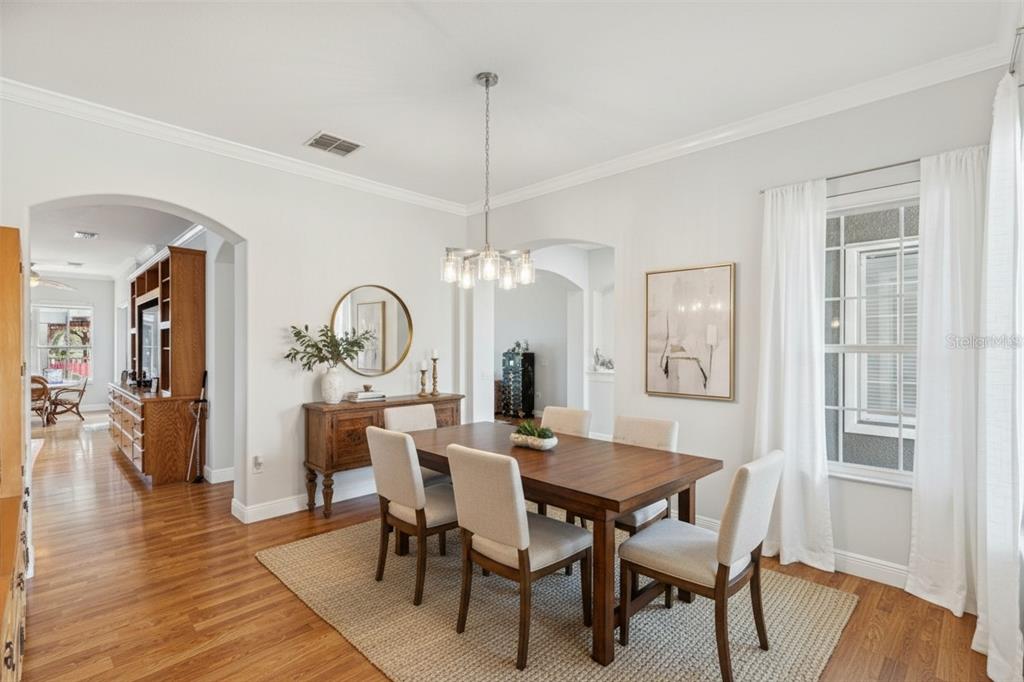 801 Glendora Road Kissimmee, FL 34759 - Photo 18 of 74 a view of a dining room with furniture window and wooden floor