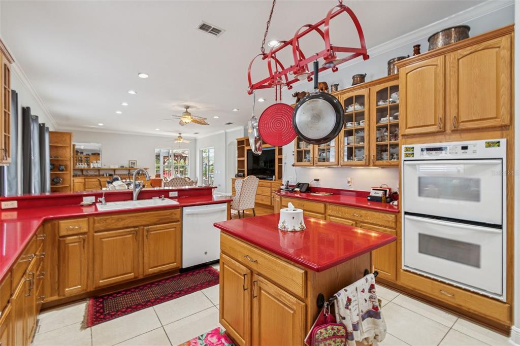 801 Glendora Road Kissimmee, FL 34759 - Photo 25 of 74 a kitchen with stainless steel appliances granite countertop a stove and a microwave