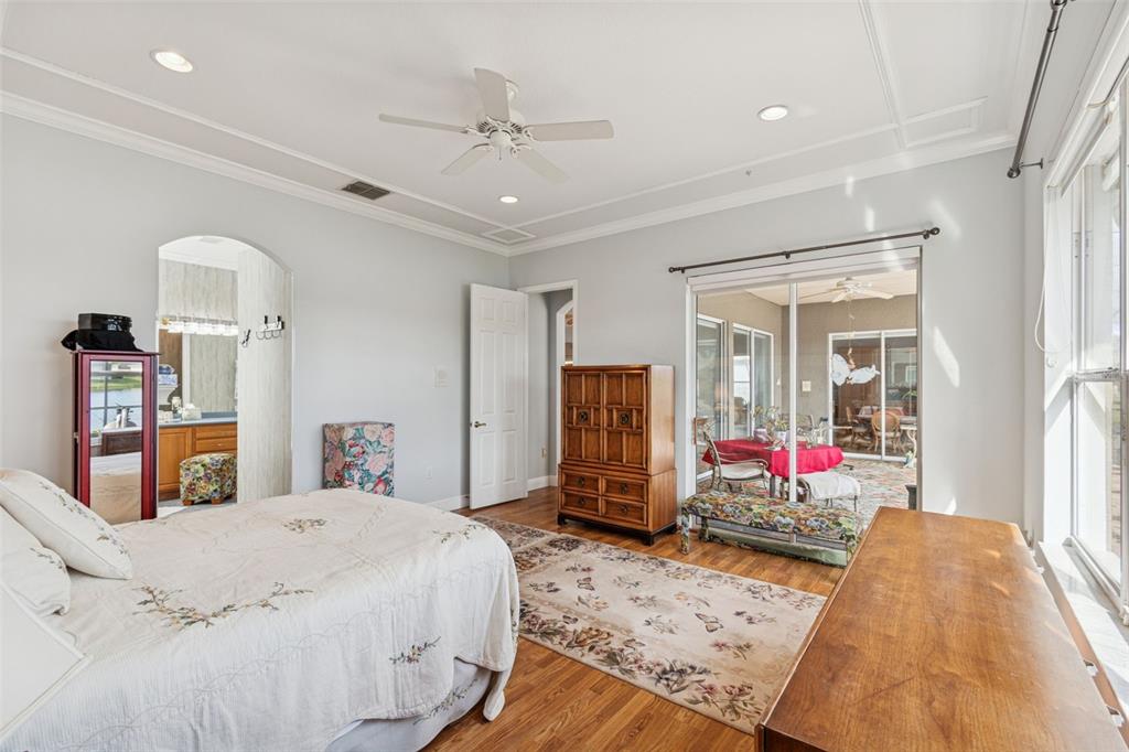 801 Glendora Road Kissimmee, FL 34759 - Photo 31 of 74 a bedroom with bed and flat tv screen