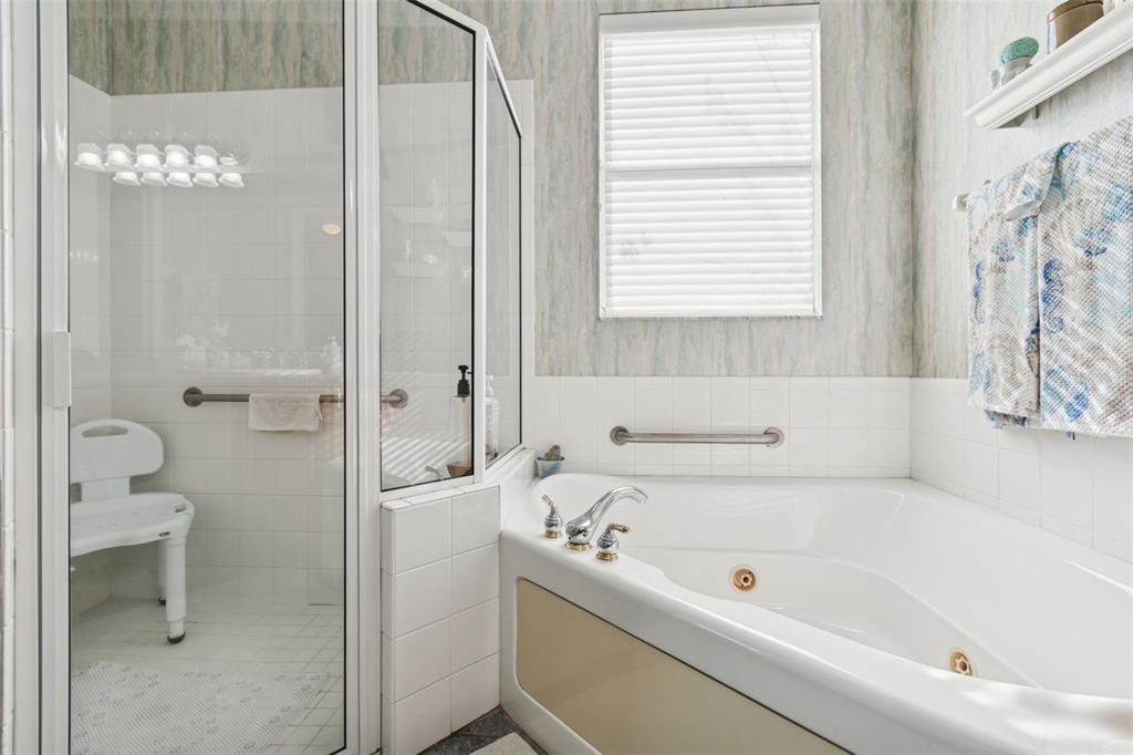 801 Glendora Road Kissimmee, FL 34759 - Photo 34 of 74 a bathroom with a bathtub and a shower