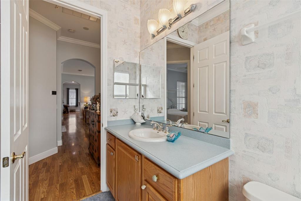 801 Glendora Road Kissimmee, FL 34759 - Photo 40 of 74 a bathroom with a sink a toilet and shower