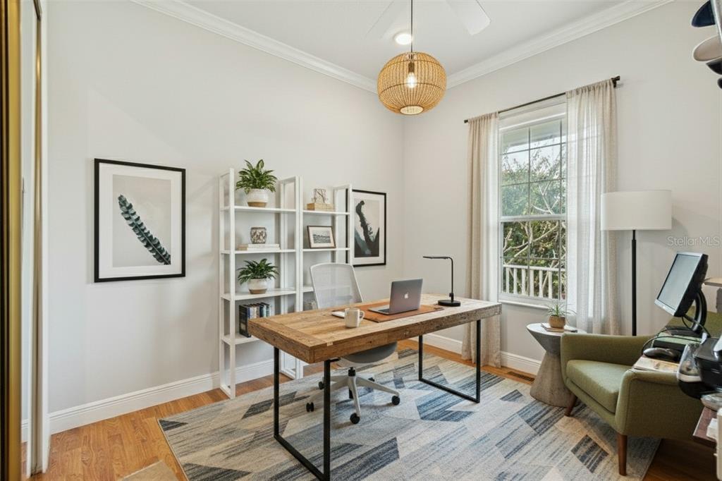 801 Glendora Road Kissimmee, FL 34759 - Photo 42 of 74 a workspace with wooden floor