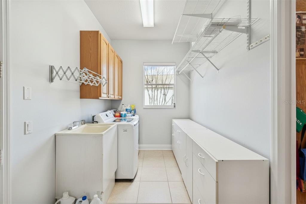 801 Glendora Road Kissimmee, FL 34759 - Photo 44 of 74 a storage room with a washer and dryer