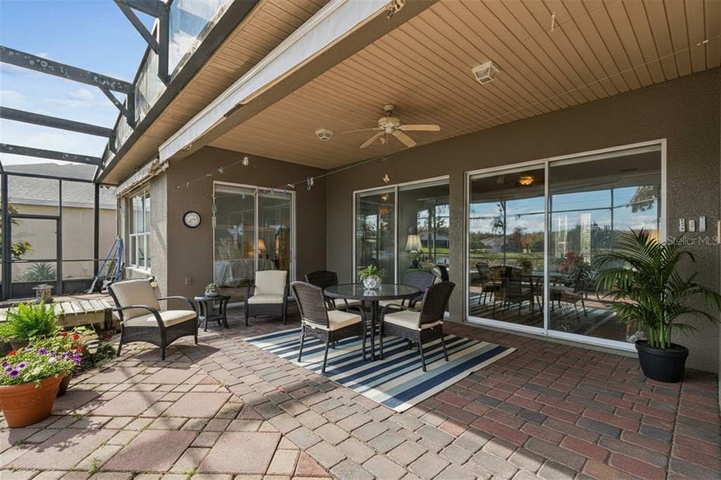 801 Glendora Road Kissimmee, FL 34759 - Photo 46 of 74 a building outdoor space with patio furniture and potted plants