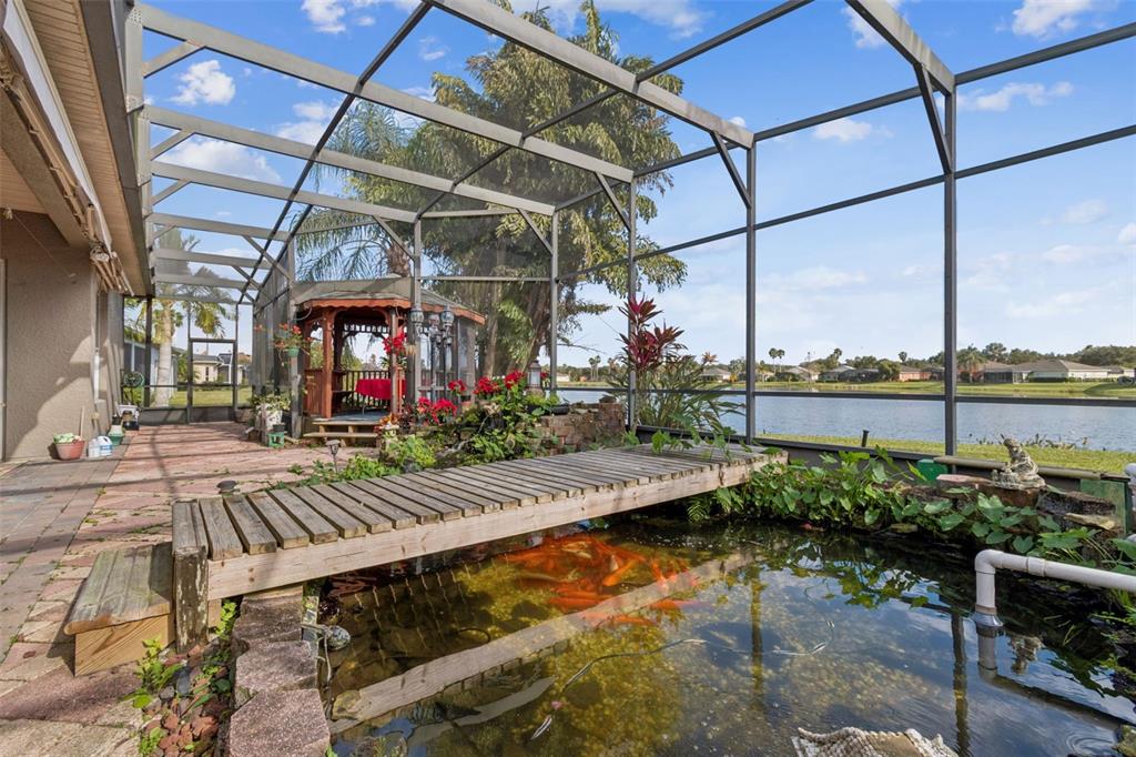 801 Glendora Road Kissimmee, FL 34759 - Photo 47 of 74 a view of a house with lake outdoor seating area and swimming pool