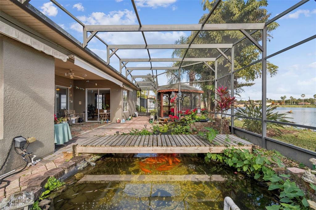 801 Glendora Road Kissimmee, FL 34759 - Photo 53 of 74 a view of a backyard with a patio and plants