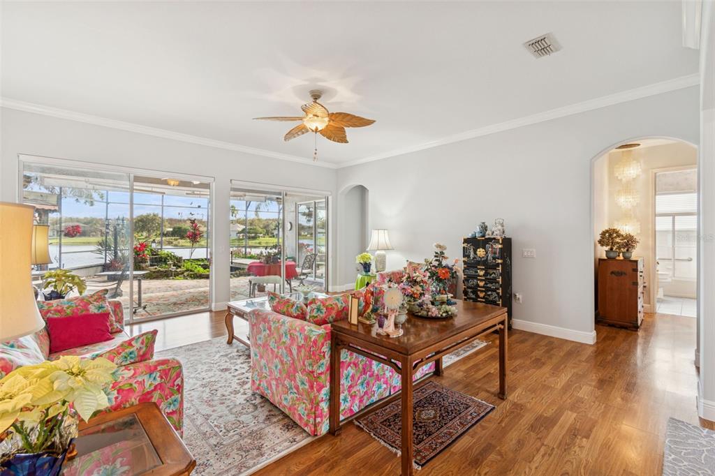 801 Glendora Road Kissimmee, FL 34759 - Photo 9 of 74 a living room with furniture and wooden floor