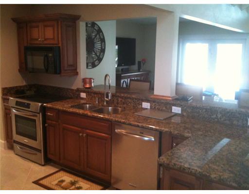 4331 Northeast Joes Point Road Jensen Beach, FL 34957 - Photo 6 of 8 a kitchen with a sink and a stove
