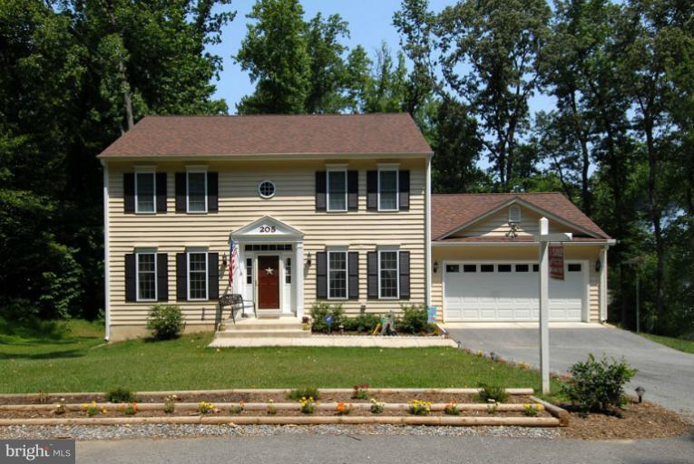 205 Captain Brendt Drive Accokeek, MD 20607 - Photo 1 of 28 front view of a house with a yard