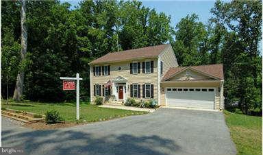 205 Captain Brendt Drive Accokeek, MD 20607 - Photo 2 of 28 a front view of a house with a yard