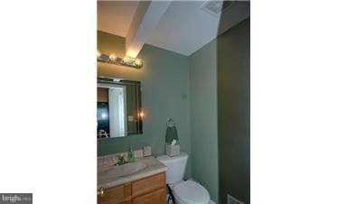 205 Captain Brendt Drive Accokeek, MD 20607 - Photo 21 of 28 a bathroom with a toilet and a mirror