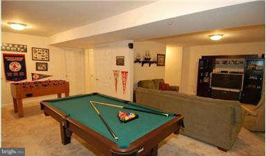 205 Captain Brendt Drive Accokeek, MD 20607 - Photo 22 of 28 a living room with furniture and flat screen tv
