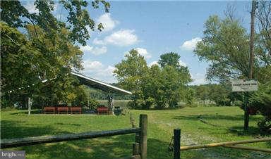 205 Captain Brendt Drive Accokeek, MD 20607 - Photo 26 of 28 a view of green field with trees in the background