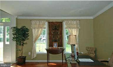 205 Captain Brendt Drive Accokeek, MD 20607 - Photo 8 of 28 a living room with furniture and a potted plant
