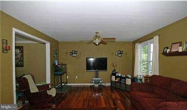 205 Captain Brendt Drive Accokeek, MD 20607 - Photo 10 of 28 a living room with furniture and a flat screen tv