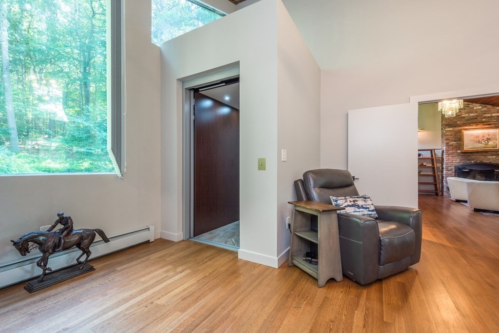 132 Littleton Road Harvard, MA 01451 - Photo 19 of 41 a room with furniture and wooden floor
