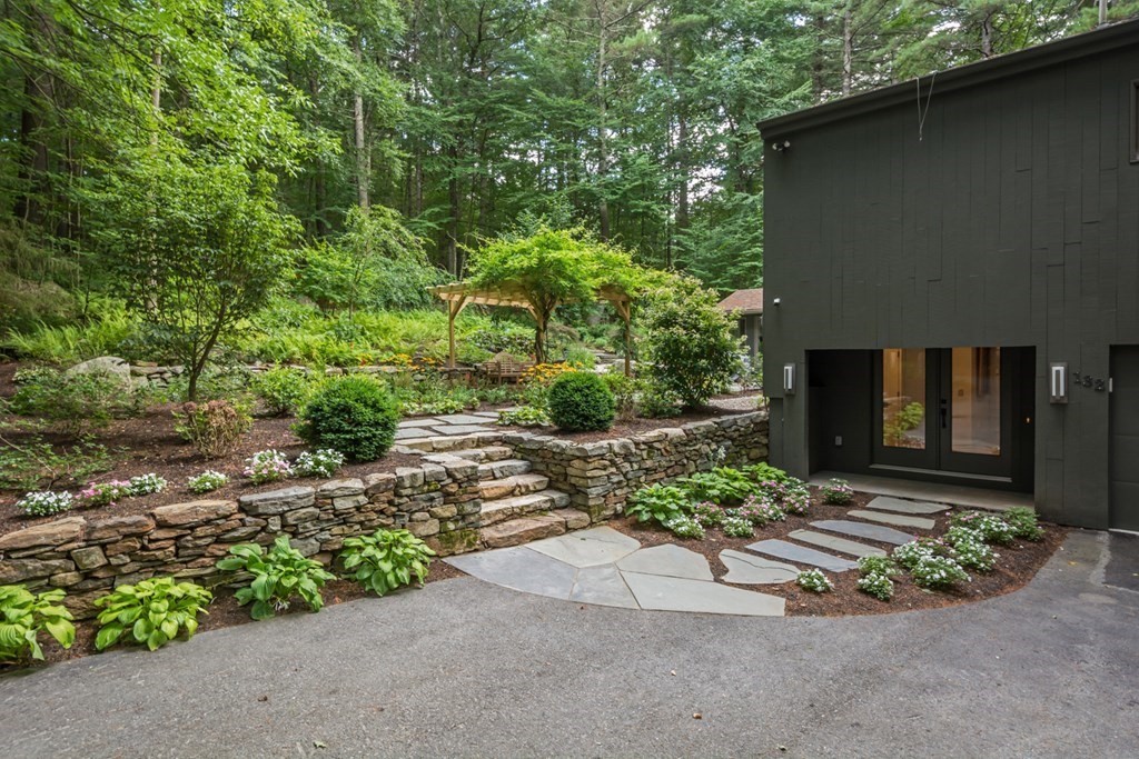 132 Littleton Road Harvard, MA 01451 - Photo 2 of 41 a view of a backyard with potted plants