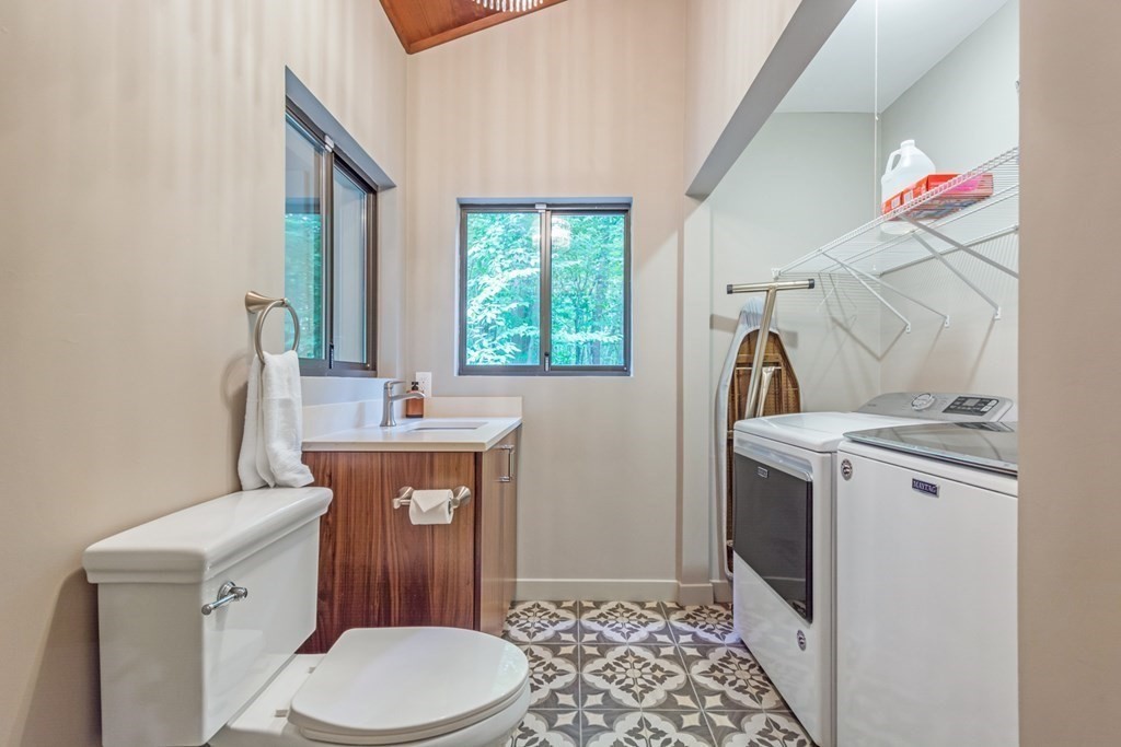 132 Littleton Road Harvard, MA 01451 - Photo 23 of 41 a bathroom with a toilet sink and mirror