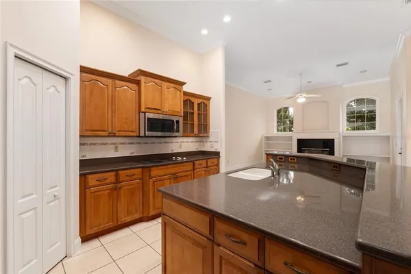 a stove top oven sitting inside of a kitchen