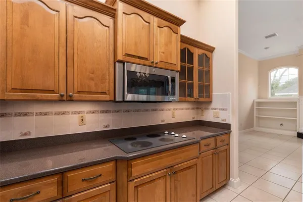 a kitchen with stainless steel appliances a sink stove and refrigerator