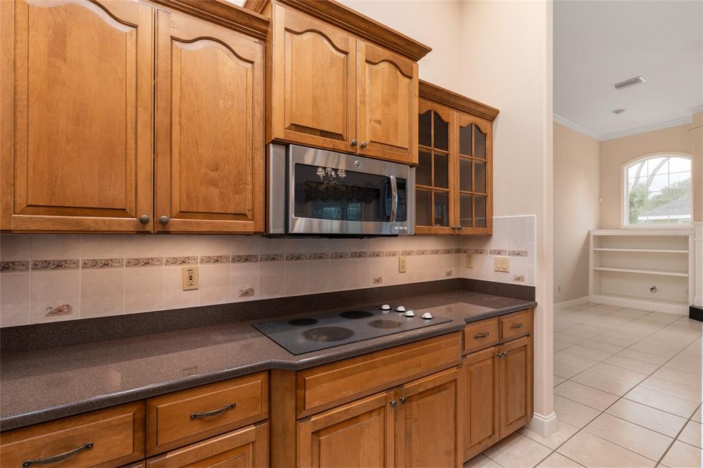 4815 Southeast 12th Place Ocala, FL 34471 - Photo 12 of 59 a stove top oven sitting inside of a kitchen
