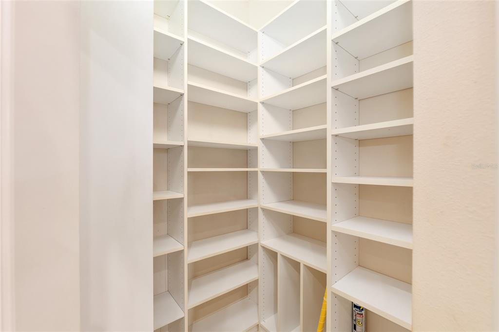 4815 Southeast 12th Place Ocala, FL 34471 - Photo 14 of 59 a view of a room with shelf on the wall