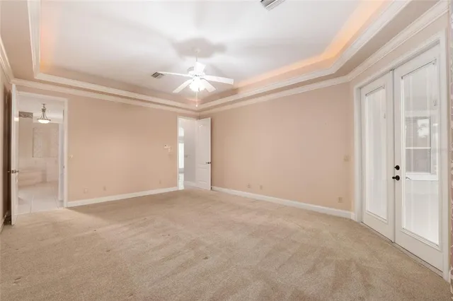 a view of a livingroom with a ceiling fan and window