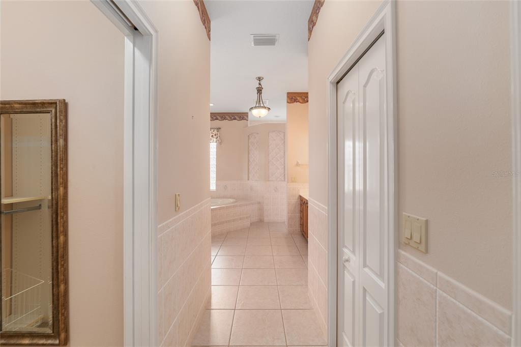 4815 Southeast 12th Place Ocala, FL 34471 - Photo 21 of 59 a view of a bathroom from a hallway