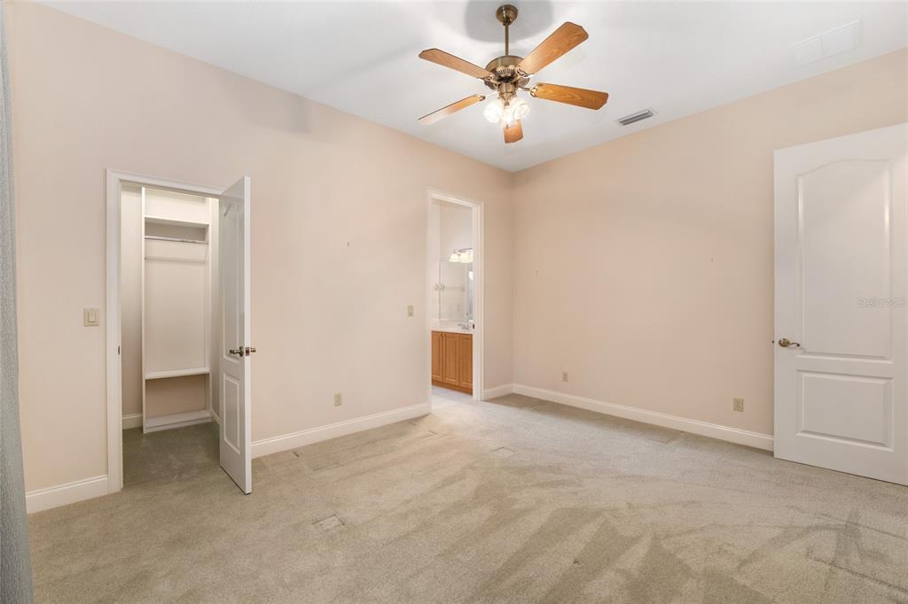 4815 Southeast 12th Place Ocala, FL 34471 - Photo 28 of 59 an empty room with a ceiling fan and a window