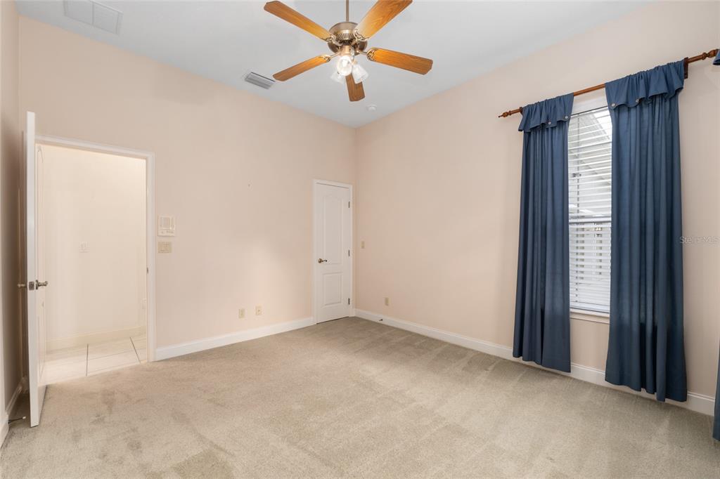 4815 Southeast 12th Place Ocala, FL 34471 - Photo 34 of 59 an empty room with closet and a chandelier fan