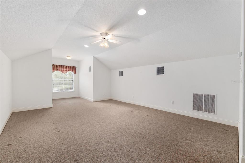4815 Southeast 12th Place Ocala, FL 34471 - Photo 38 of 59 a view of a livingroom with a ceiling fan and window