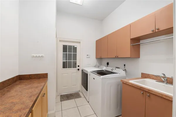 a room with a window a sink and a table