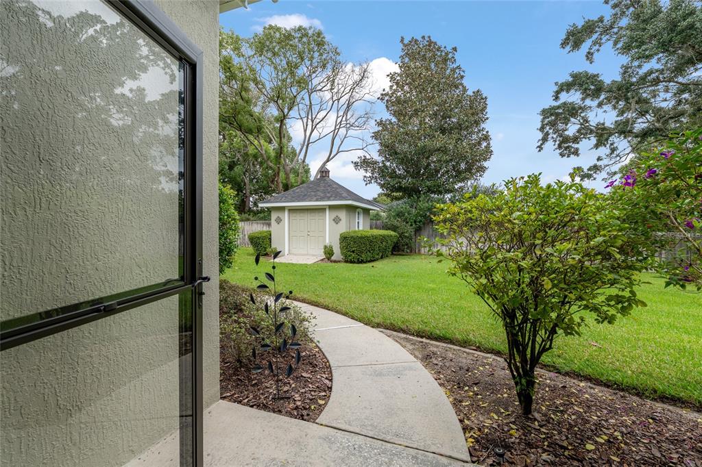 4815 Southeast 12th Place Ocala, FL 34471 - Photo 50 of 59 a view of a house with a tree in the background