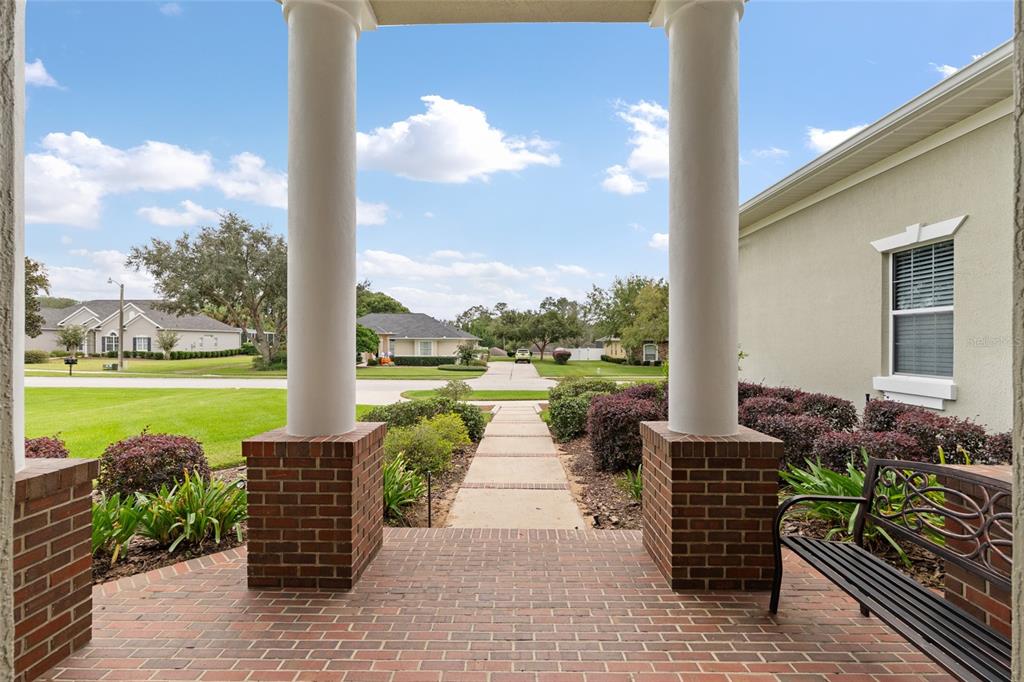 4815 Southeast 12th Place Ocala, FL 34471 - Photo 5 of 59 a view of a patio with dining table and chairs
