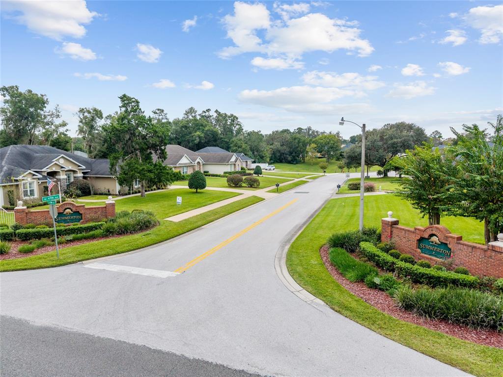 4815 Southeast 12th Place Ocala, FL 34471 - Photo 58 of 59 a view of a swimming pool with a yard and plants