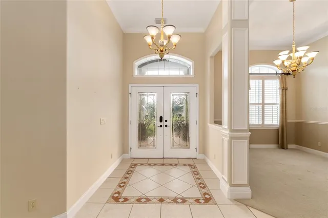 a kitchen with stainless steel appliances granite countertop a sink refrigerator stove and microwave