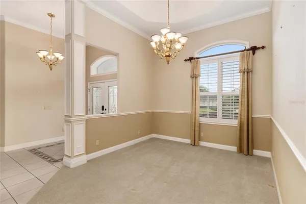 a living room with stainless steel appliances kitchen island granite countertop furniture and a fireplace