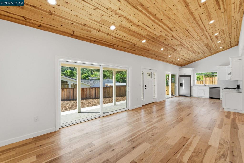 3196 Rohrer Drive Lafayette, CA 94549 - Photo 11 of 30 a view of empty room with wooden floor and sliding door