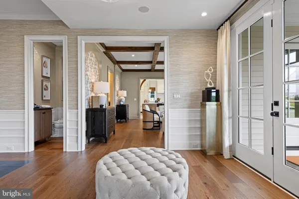 a bedroom with furniture and a wooden floor