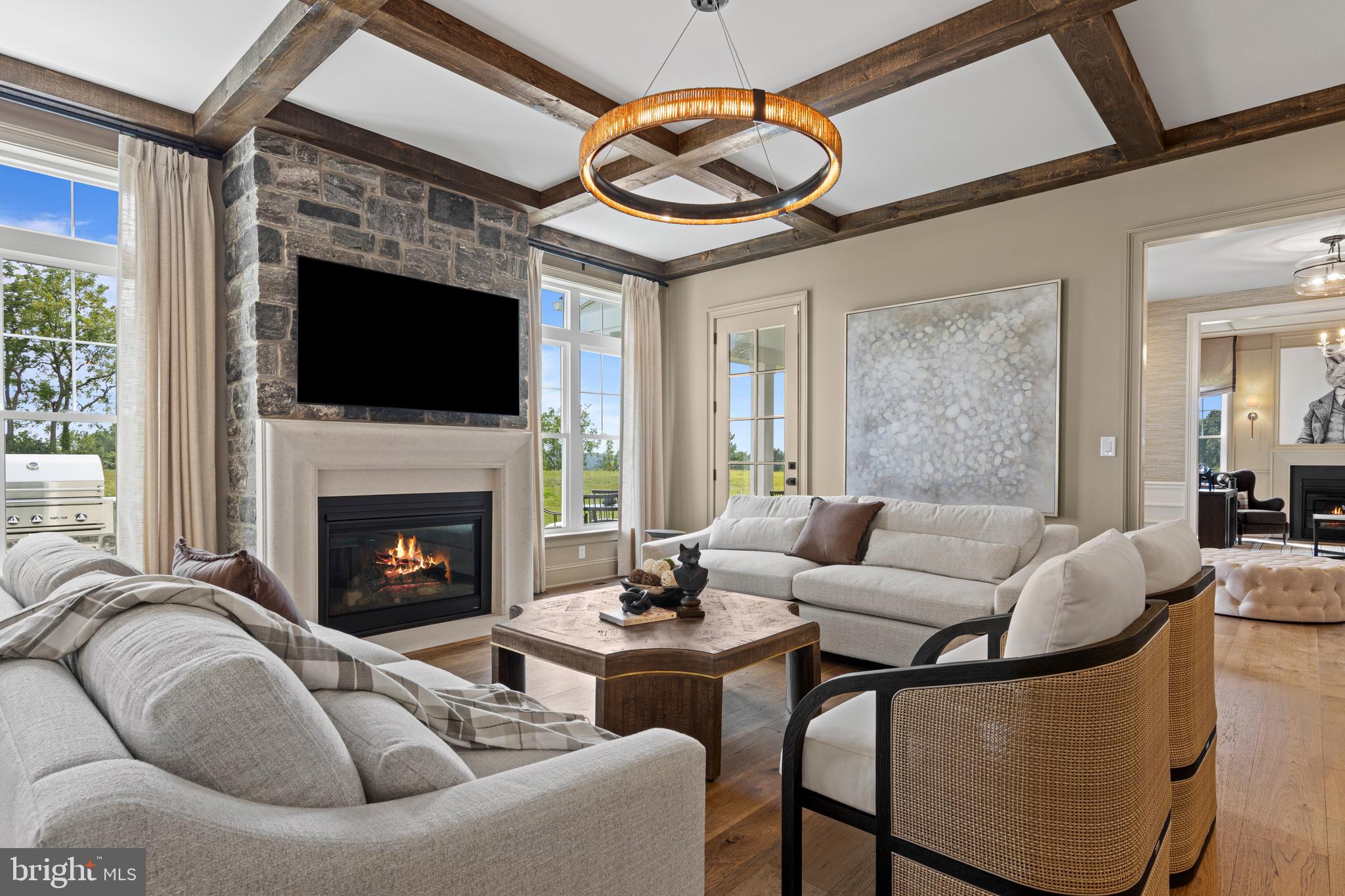 200 Concord Way, Unit MODEL Glenmoore, PA 19343 - Photo 13 of 48 a living room with furniture a fireplace and a flat screen tv