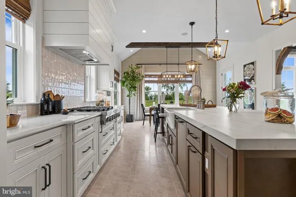 a kitchen with lots of counter space and window