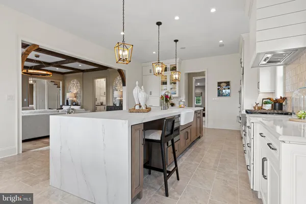 a large kitchen with a table and chairs
