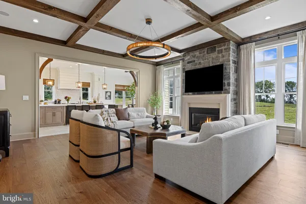a living room with fireplace furniture and a flat screen tv