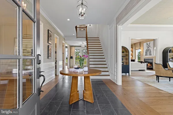 a view of entryway with wooden floor and furniture