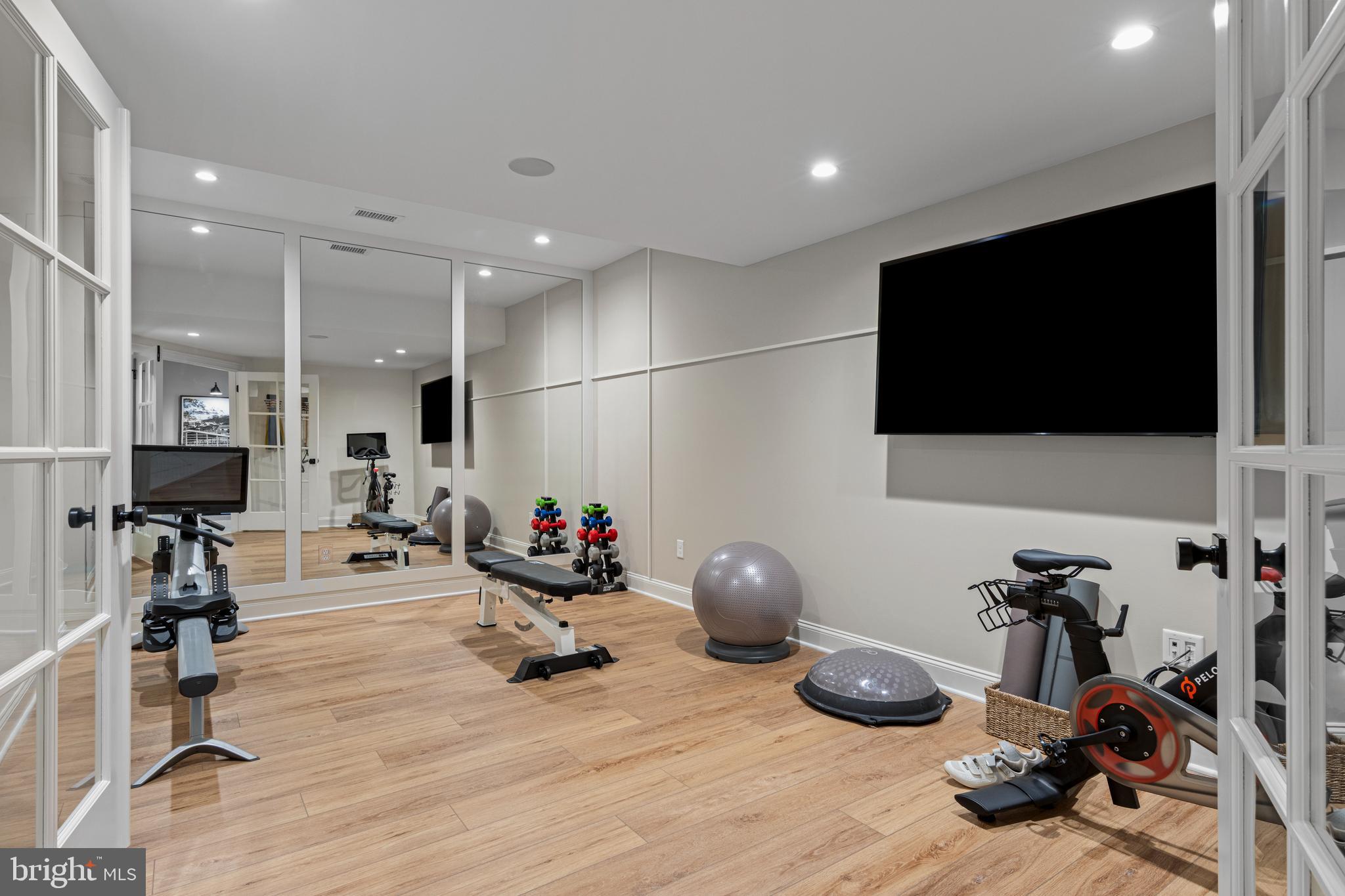 200 Concord Way, Unit MODEL Glenmoore, PA 19343 - Photo 43 of 48 a room with gym equipment and a flat screen tv