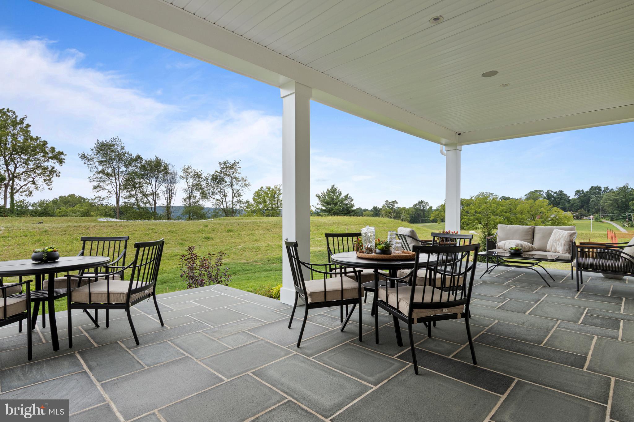 200 Concord Way, Unit MODEL Glenmoore, PA 19343 - Photo 46 of 48 a view of a city from a dining room with furniture and floor to ceiling window