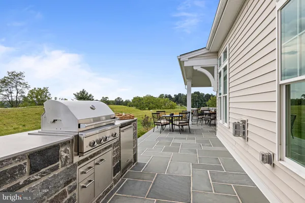 a view of a balcony with chairs