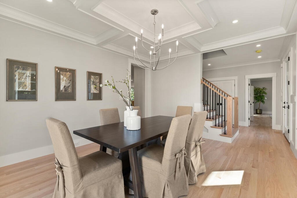 445 Lowell Street Lexington, MA 02420 - Photo 13 of 41 a view of a dining room with furniture and wooden floor