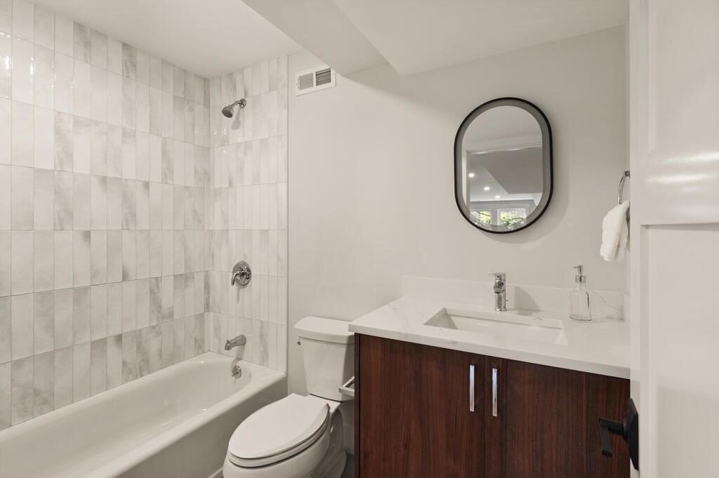 445 Lowell Street Lexington, MA 02420 - Photo 32 of 41 a bathroom with a sink a toilet and a bathtub